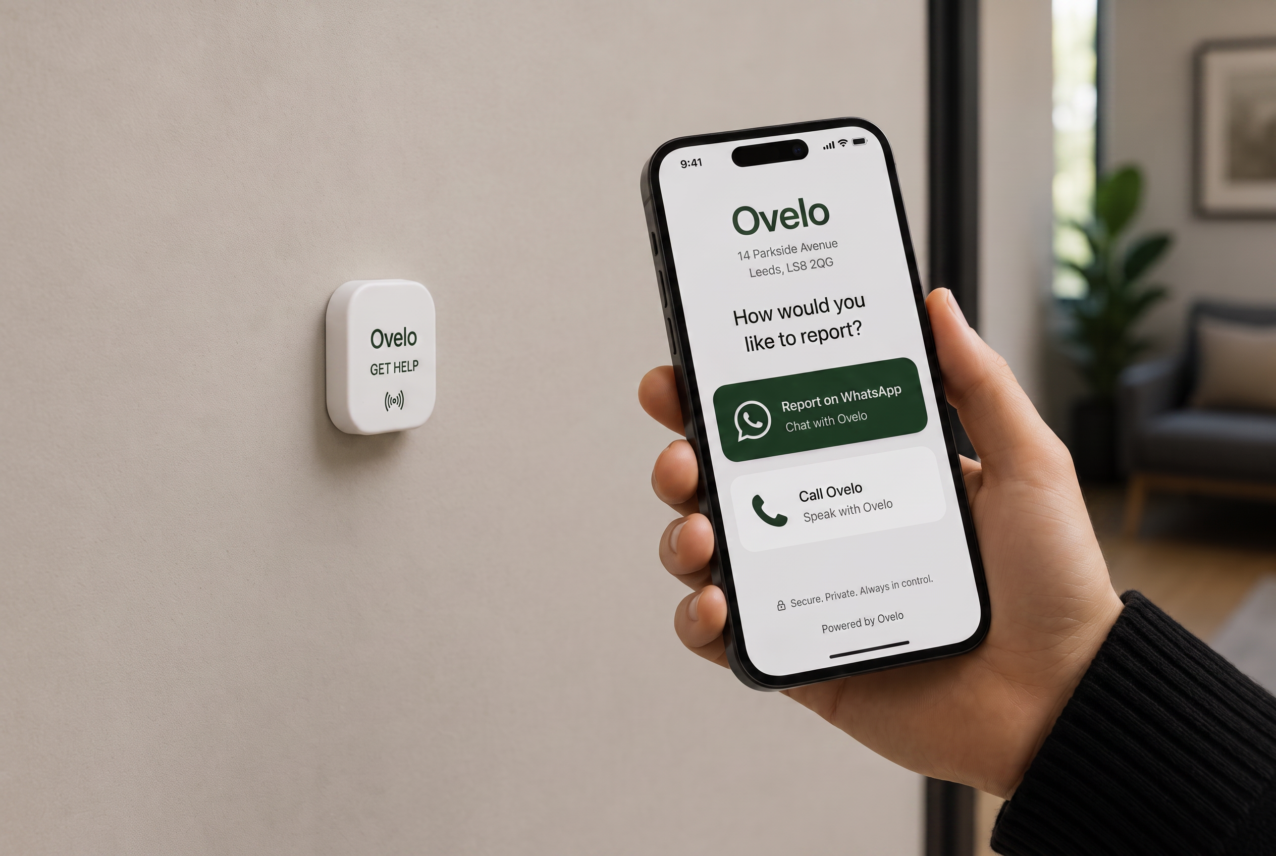 A phone tapping a wall-mounted Ovelo device, opening options to report on WhatsApp or call Ovelo